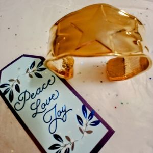 Gold tone cuff bracelet